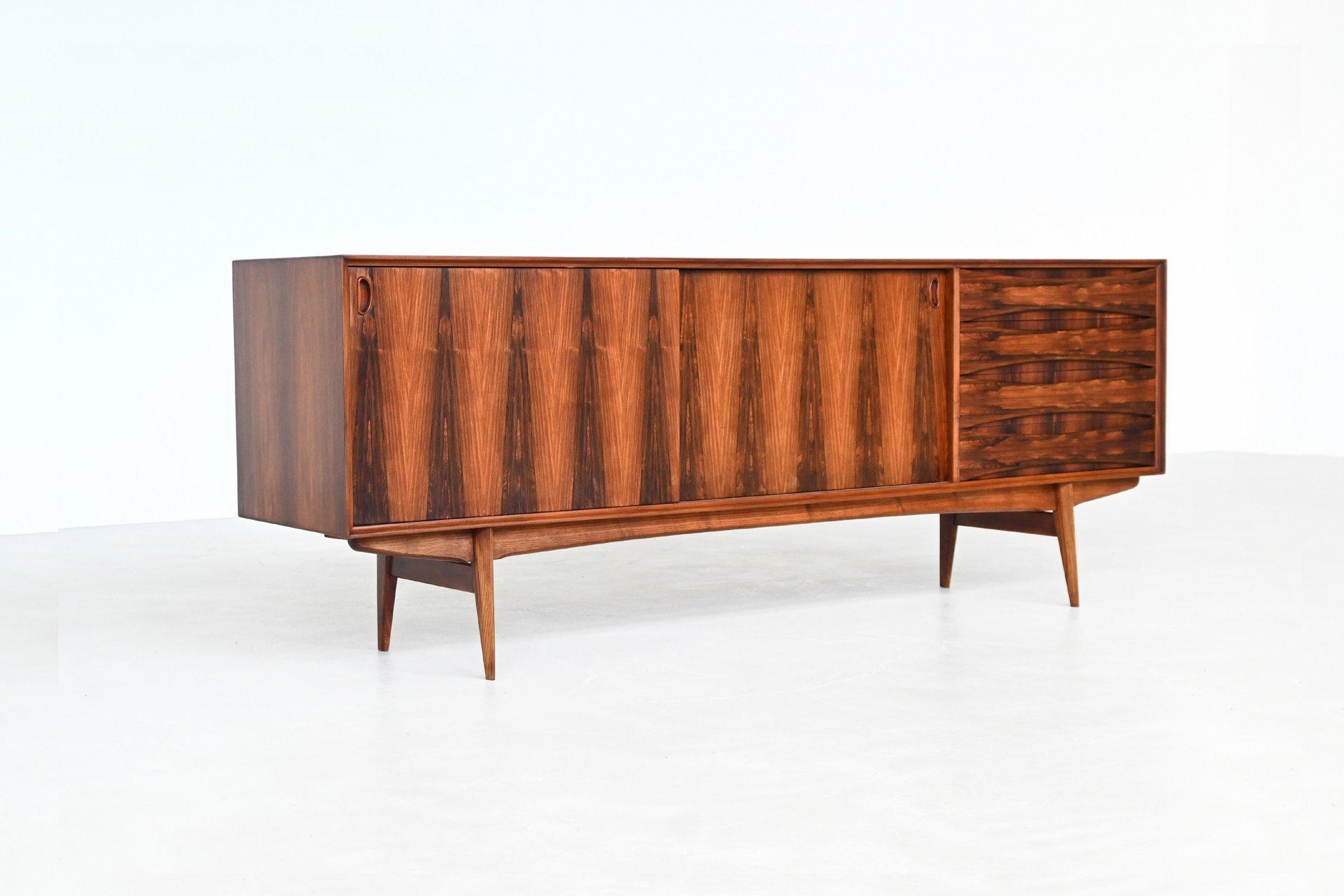 Stunning “Paola” sideboard designed by Oswald Vermaercke for V-Form, Belgium 1960. A refined example of Belgian mid-century craftsmanship, the piece is executed in richly figured rosewood, showcasing dramatic grain patterns throughout, most notably