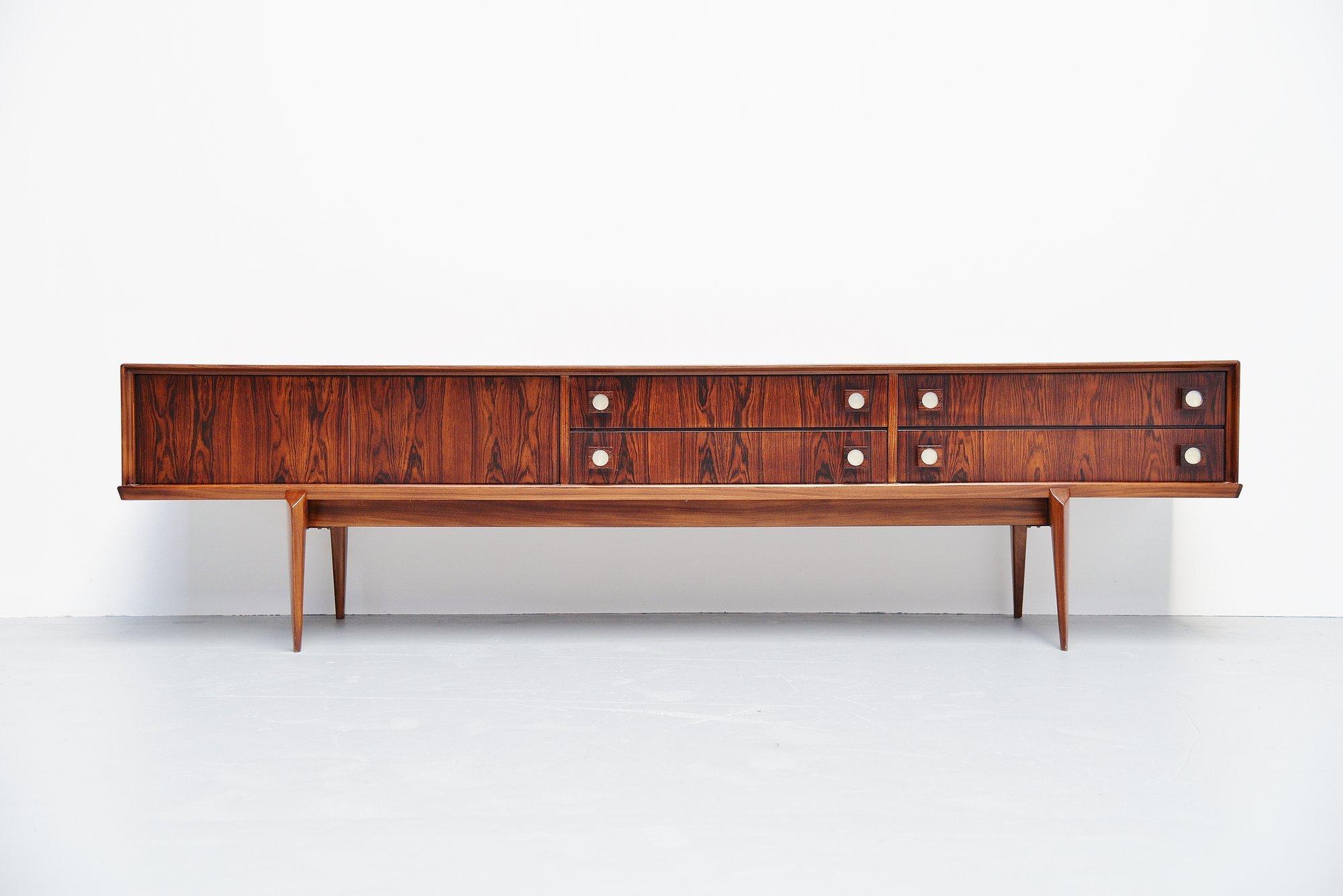 Very nice and quality low sideboard designed by Oswald Vermaercke for V-Form, Belgium 1965. This amazing credenza has a very nice and warm rosewood color and is fully refinished into perfect condition. The designs by Oswald Vermaercke are visibly