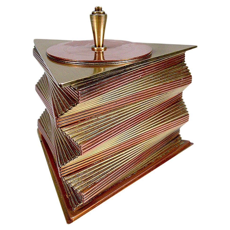 Pair of matching rare 1935 all-original decorative boxes designed and produced by John Otar in California. These boxes feature individual triangular brass and copper plates stacked to create a spectacular, twisting spiral form. They are signed on