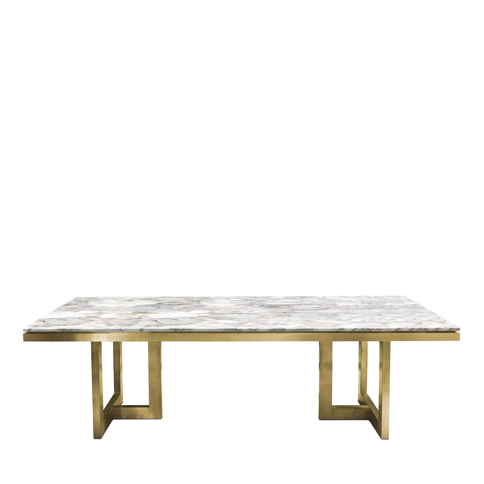 Timeless and majestic, this dining table is a one of a kind, superb example of traditional craftsmanship, combined with the use of precious materials. The base in wood features two sets of feet with a lavish gold leaf that strikingly complements the
