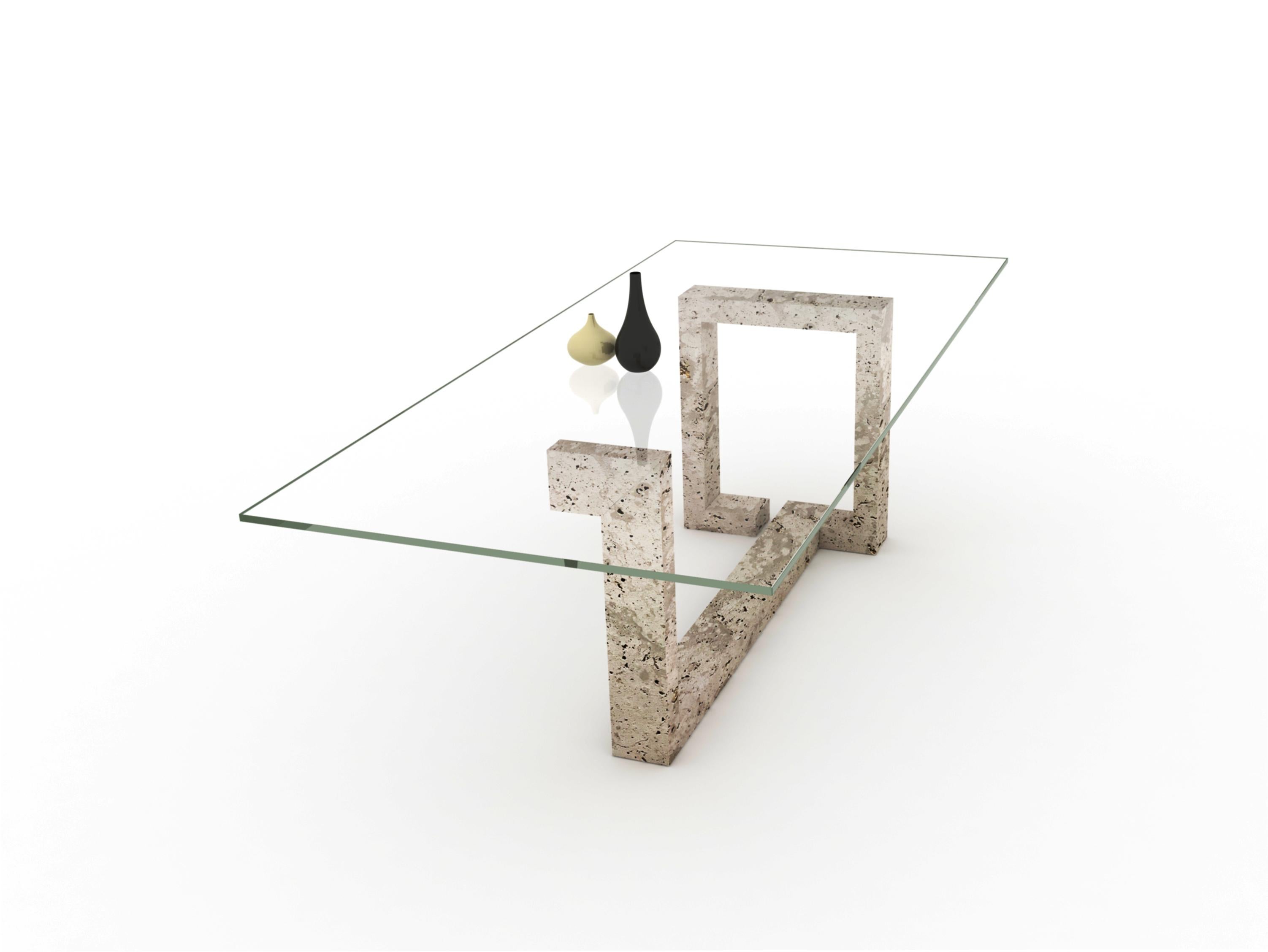 The OTEYZA dining table in travertine marble is designed by Joaquín Moll for Archivo Collection Meddel. A linear marble structure with a transparent glass surface. An artistic and sculptural table design.

OTEYZA is a sculptural table with light