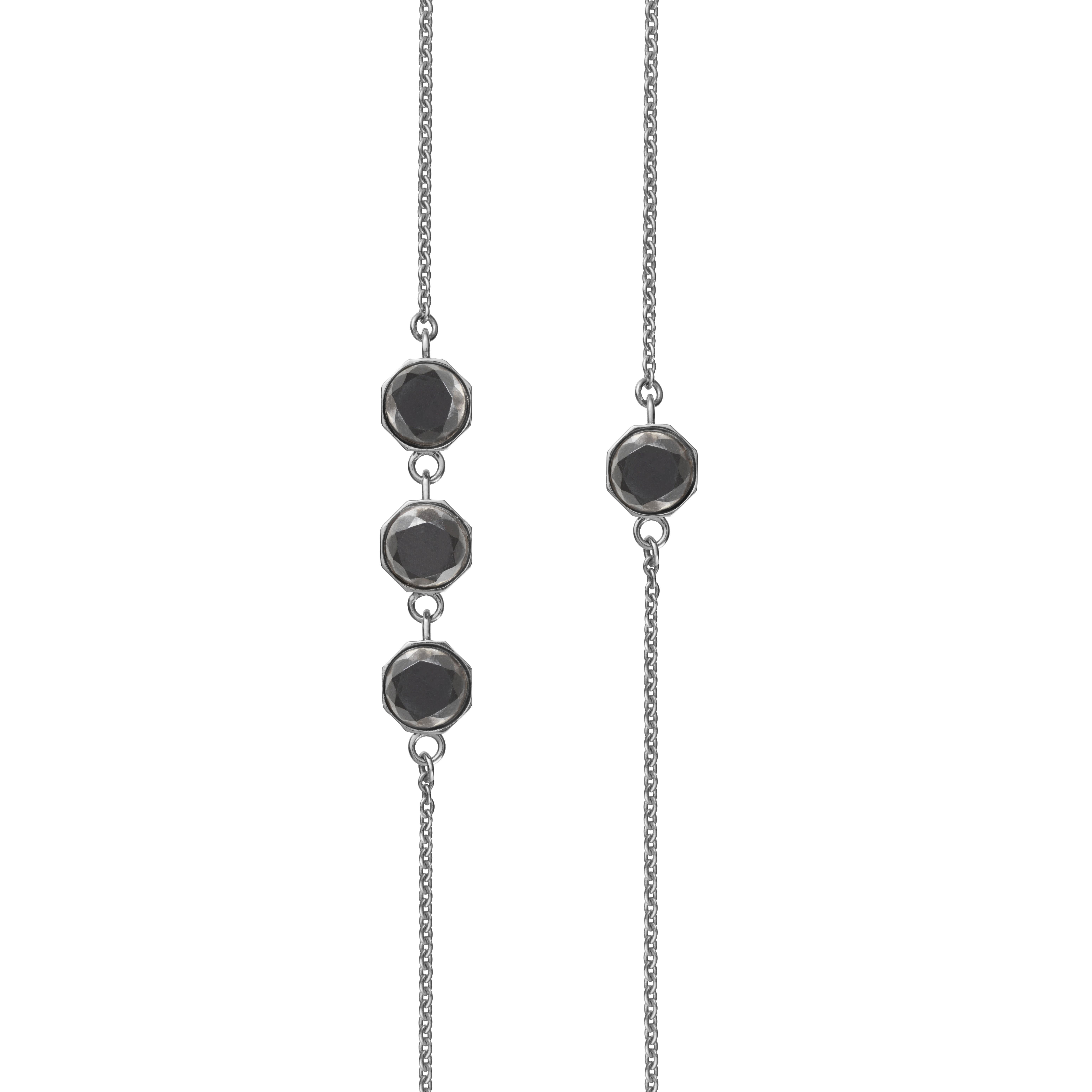 Also available in recycled 18k gold.

OTHER BLOOMS long necklace in solid recycled sterling silver with nine Old European Cut Mpingo Blackwood diamonds. Wear it full length or double.

Dimensions:
Length: 90 cm incl. S-lock and eyelet. Diamonds; 0,5