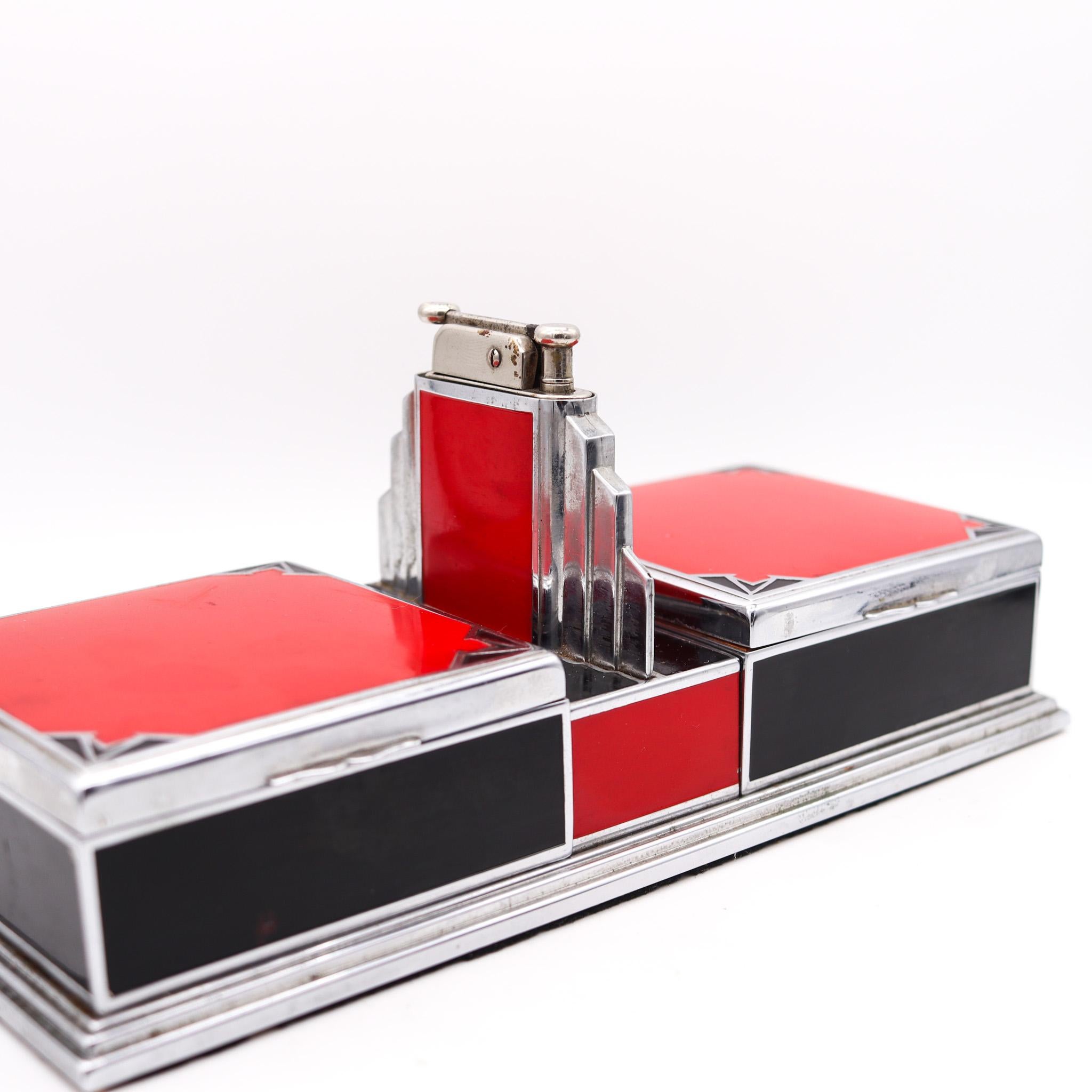 Art deco machine age box designed by Otis-Elgin Craft.

A very fine and rare original 1928 iconic Art Deco Machine Age desk box. This combine a double cigarette smokers box with a removable lighter from the modernist streamlined era of industrial
