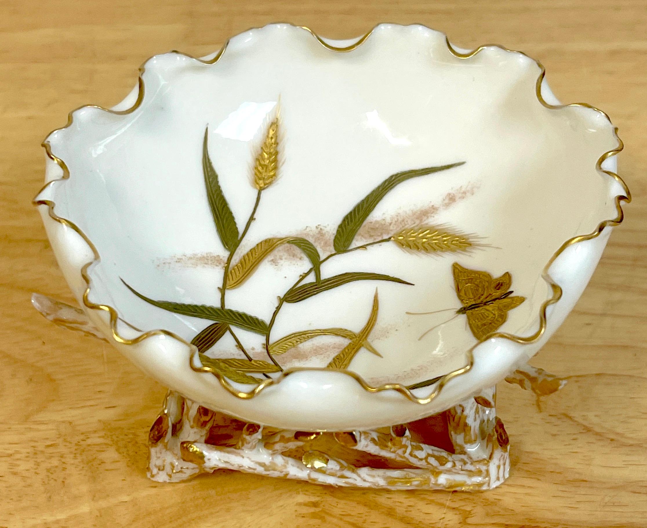 Ott & Brewer American Belleek, Aesthetic Movement Bowl 
USA, Trenton NJ, circa 1880s

A fine and rare example of a short lived period in American porcelain, in the Aesthetic taste. The crimped bowl decorated in raised gilt enamel depicting a