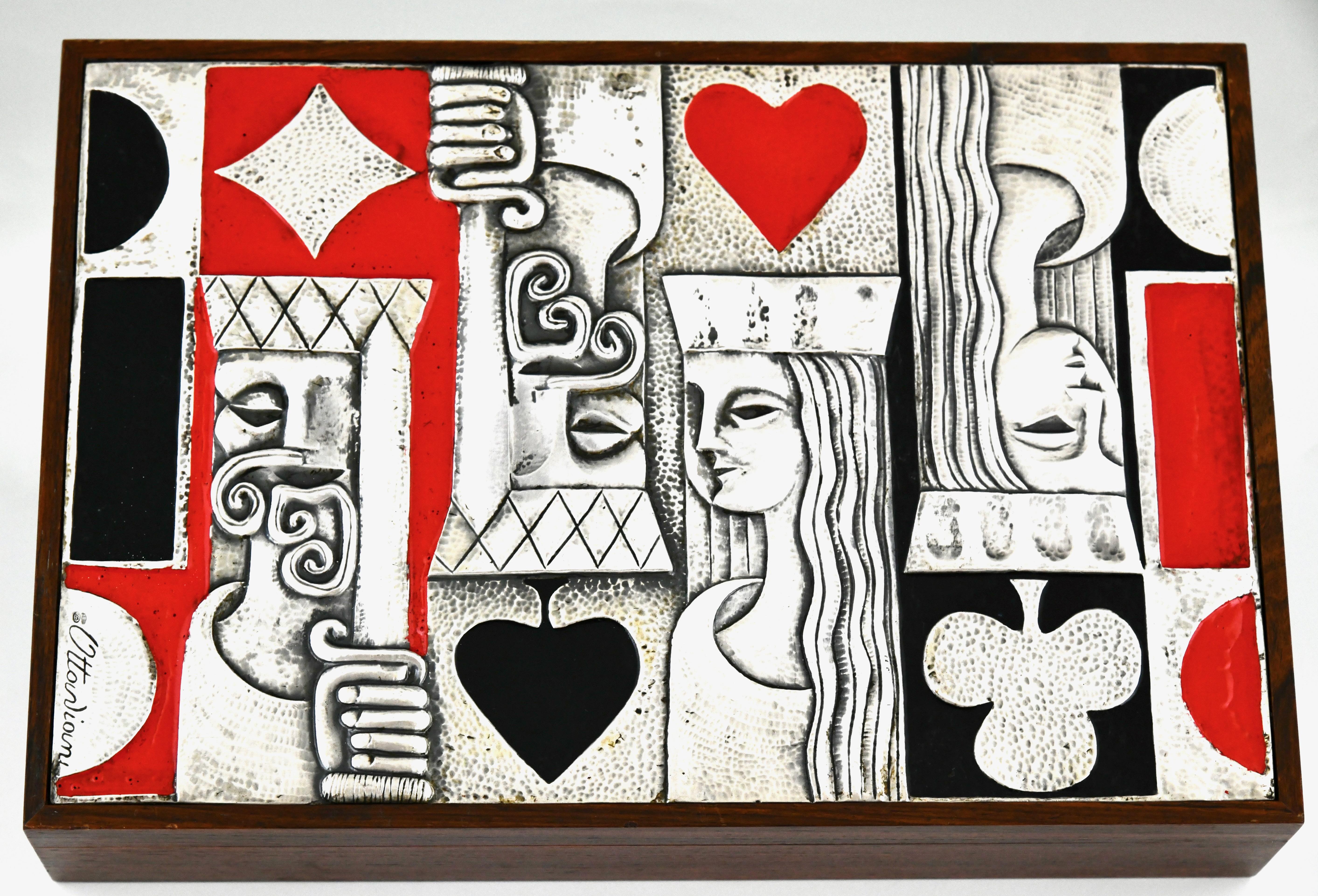 Mid Century Sterling silver enamel and wood playing card box, Italy 1979.
Signed Ottaviani, Sterling silver 925 mark. 
Complete set of playing cards, dice, cup and chips.

Ottaviani (1945) is a jewelry and silver firm located in the small seaside