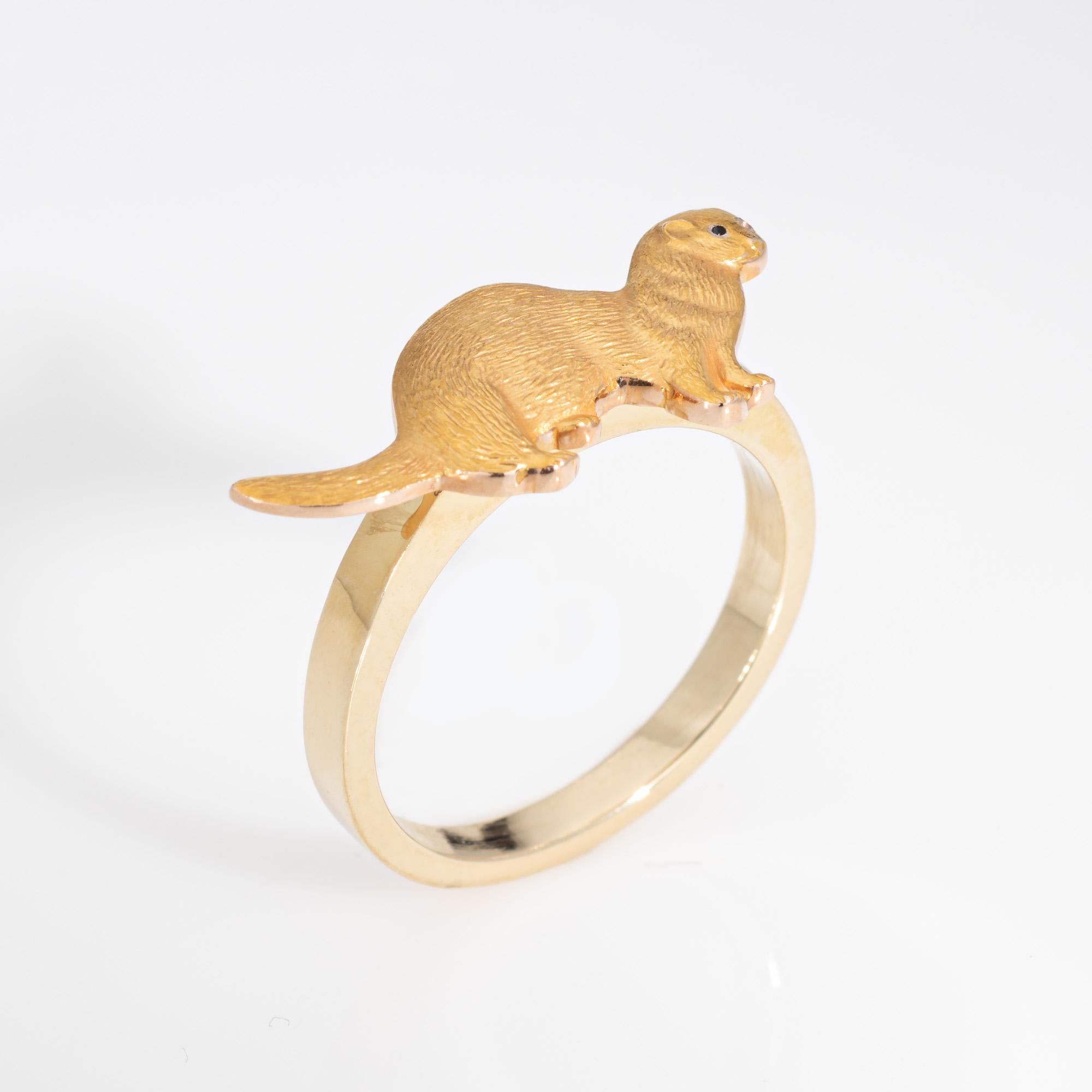 Distinct otter ring crafted in 14 karat yellow gold.

Originally a stick pin, we converted the piece to a ring. The sweet otter features a textured design for a muted gold effect. The ring is great worn alone or stacked. The low rise ring (3.5mm -