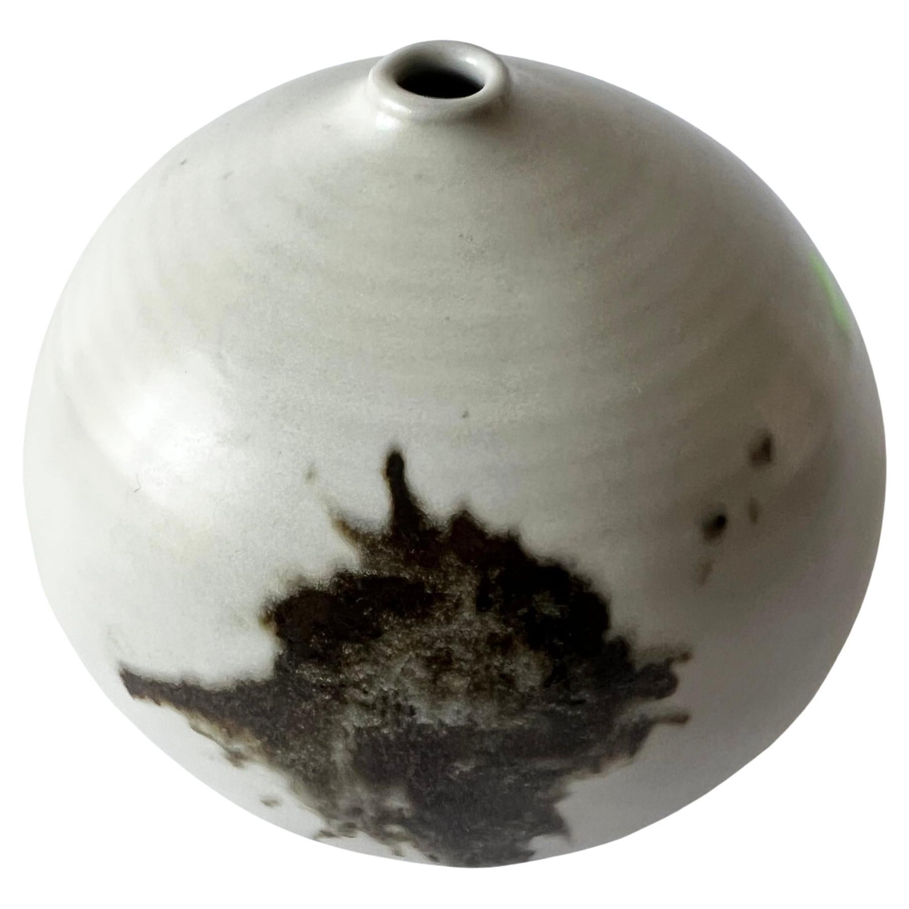 White splash ball vase created by Otto and Vivika Heino of Ojai, California.  Vase measures 5