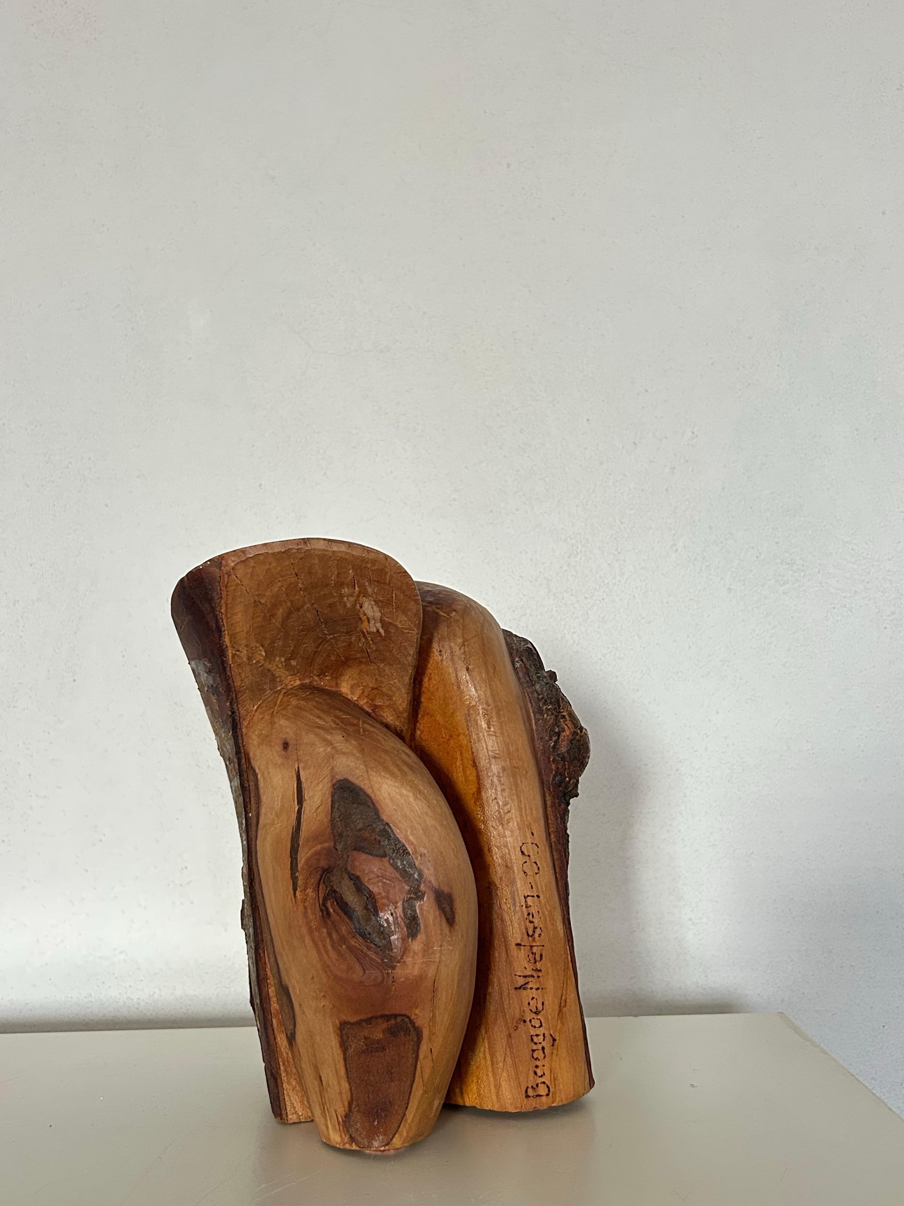 sculpture carved from a single solid piece of wood by Danish artist Otto Baagøe Nielsen, created in 2000. The piece exemplifies Nielsen’s mastery of form — a harmonious balance between organic movement and precise craftsmanship, rendered with a deep
