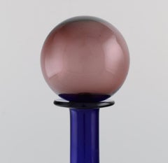 Otto Brauer for Holmegaard. Bottle in blue art glass with purple ball