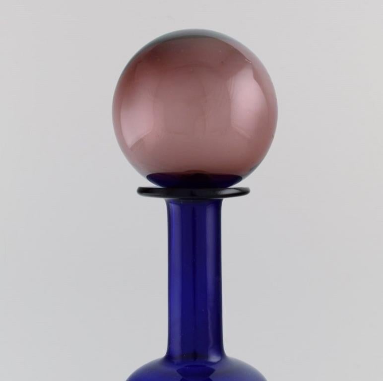 Scandinavian Modern Otto Brauer for Holmegaard. Bottle in blue art glass with purple ball For Sale