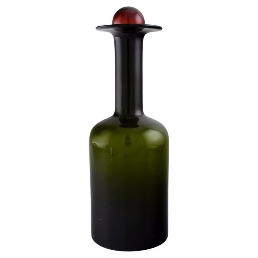 Otto Brauer for Holmegaard. Bottle in green art glass with red ball, 1960s