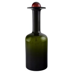 Otto Brauer for Holmegaard. Bottle in green art glass with red ball, 1960s