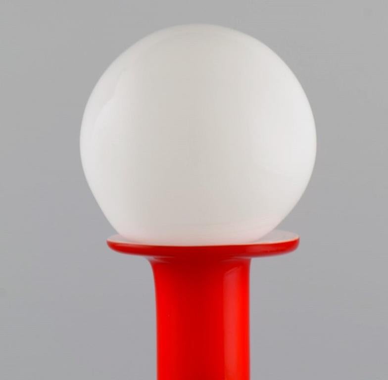 Scandinavian Modern Otto Brauer for Holmegaard. Bottle in red mouth-blown art glass with white ball. For Sale