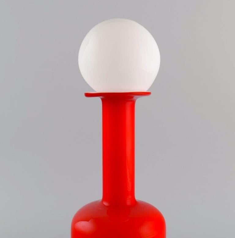 Danish Otto Brauer for Holmegaard. Bottle in red mouth-blown art glass with white ball. For Sale