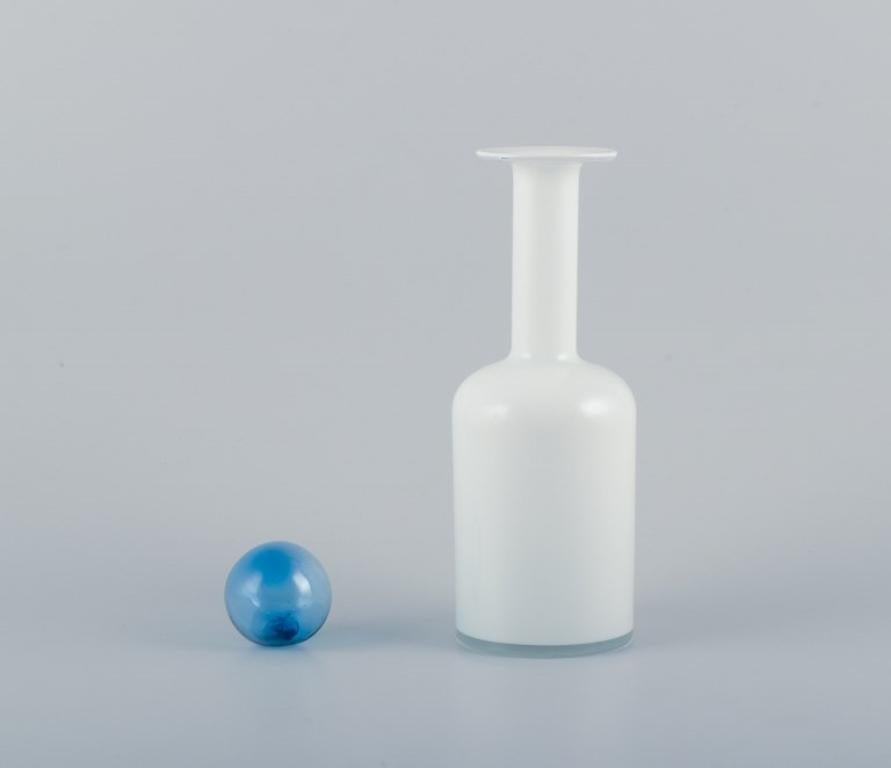 Danish Otto Brauer for Holmegaard. Bottle in white art glass with a light blue ball. For Sale