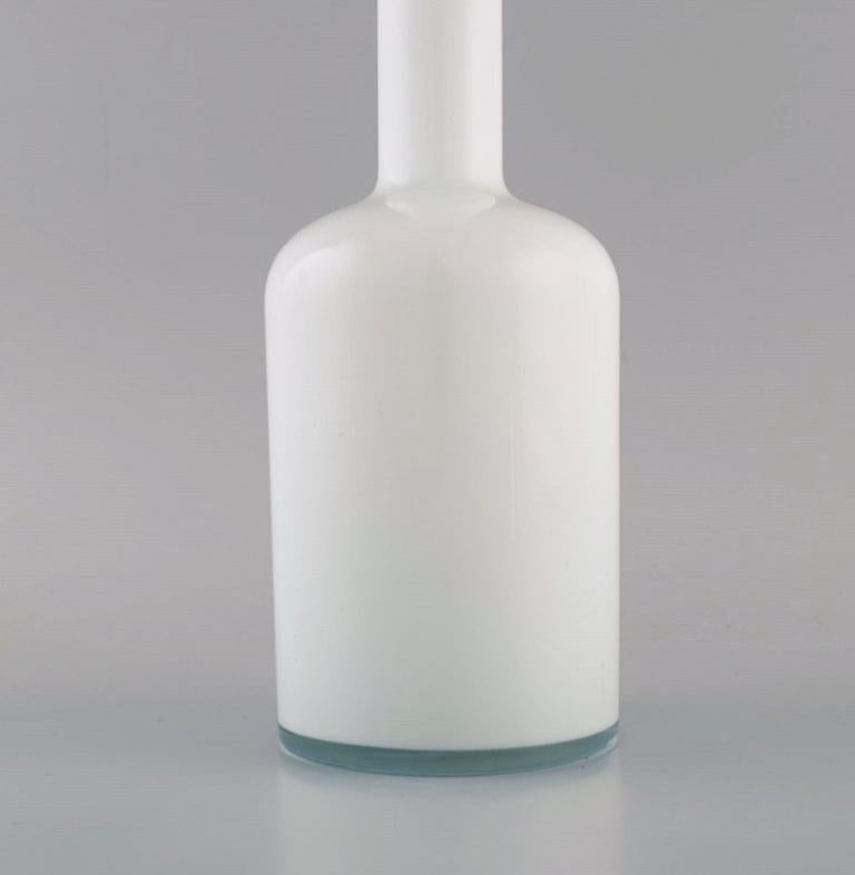 Danish Otto Brauer for Holmegaard. Bottle in white art glass with light blue ball For Sale
