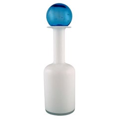 Otto Brauer for Holmegaard. Bottle in white art glass with light blue ball