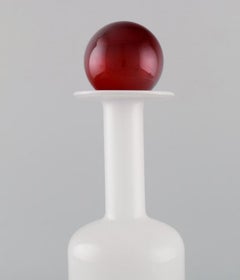 Otto Brauer for Holmegaard. Bottle in white art glass with red ball. 1960s