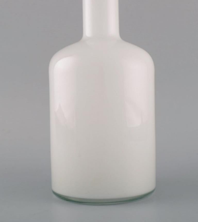 Scandinavian Modern Otto Brauer for Holmegaard. Bottle in white art glass with red ball. 1960s For Sale