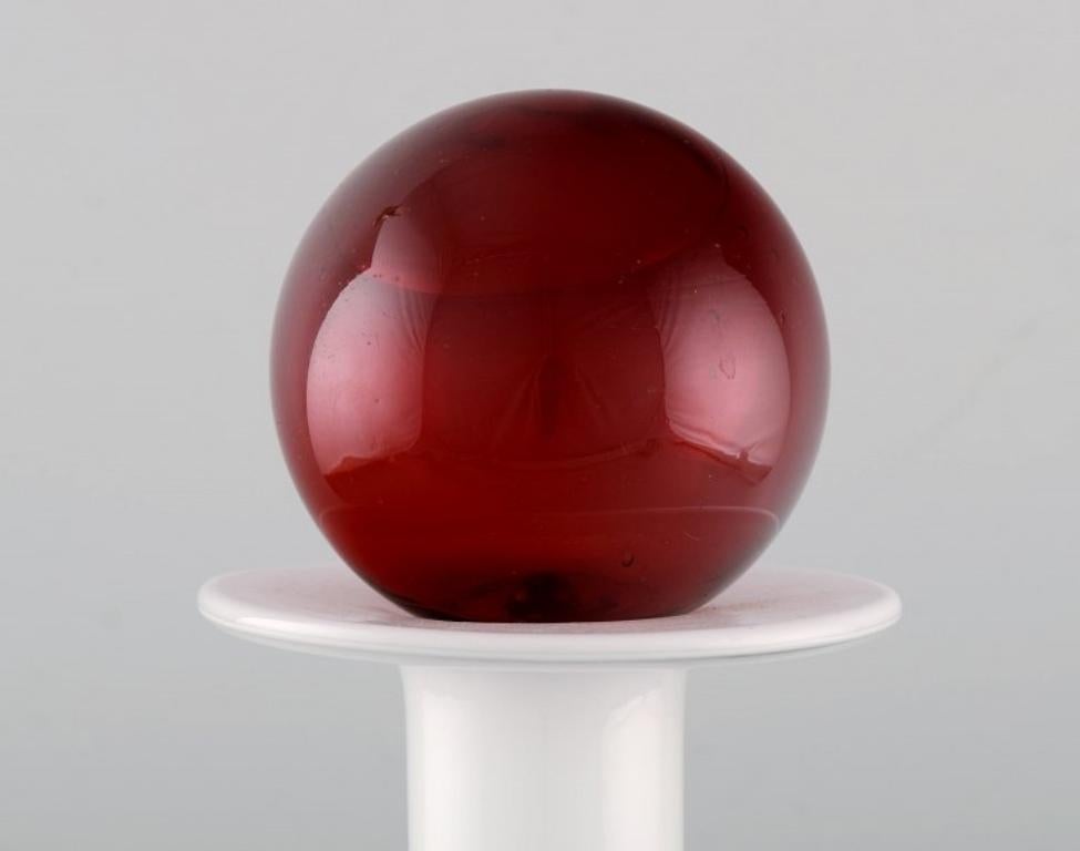 Danish Otto Brauer for Holmegaard. Bottle in white art glass with red ball. 1960s For Sale