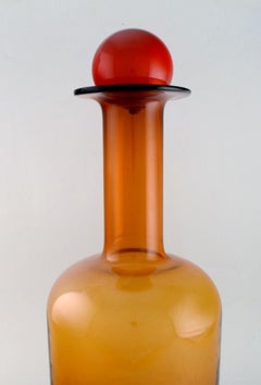 Otto Brauer for Holmegaard. Colossal bottle in brown art glass with red ball