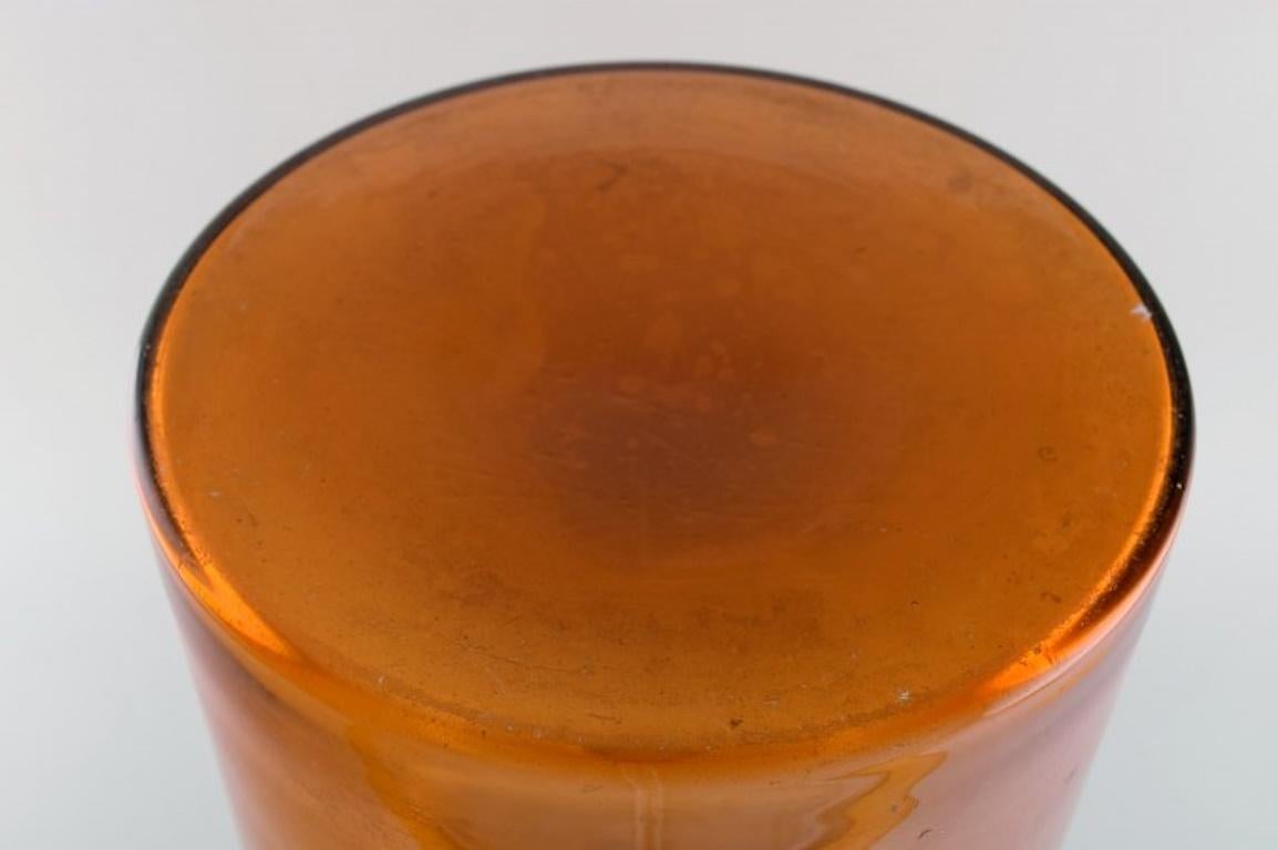 Mid-20th Century Otto Brauer for Holmegaard. Colossal bottle in brown art glass with red ball For Sale