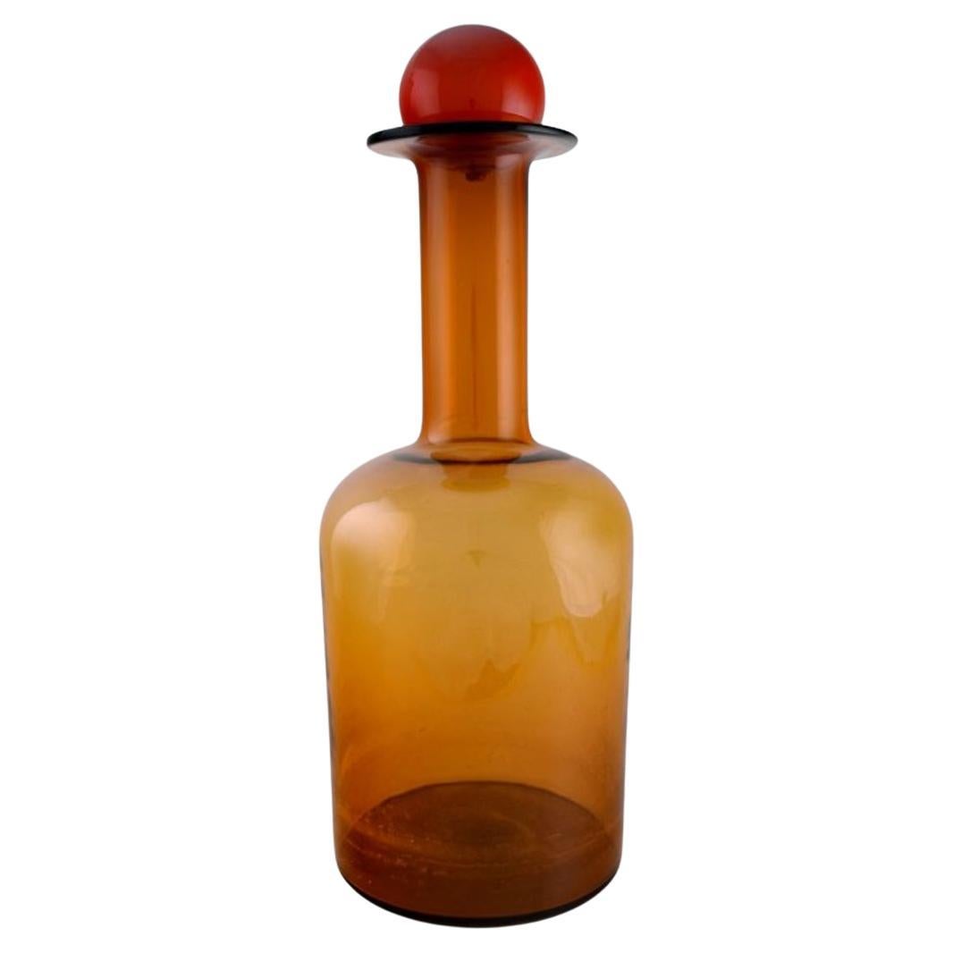 Otto Brauer for Holmegaard. Colossal bottle in brown art glass with red ball