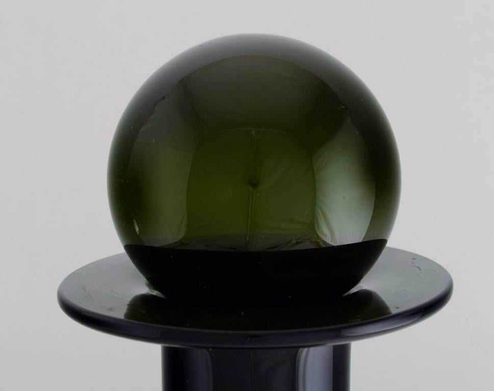 Otto Brauer for Holmegaard.  Colossal bottle in green art glass with green ball In Excellent Condition For Sale In Copenhagen, DK