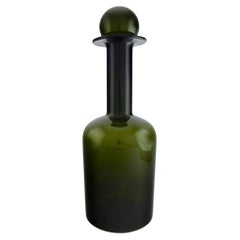 Otto Brauer for Holmegaard.  Colossal bottle in green art glass with green ball