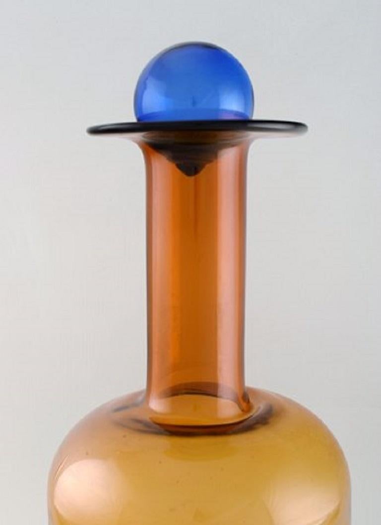 Otto Brauer for Holmegaard. Colossal vase or bottle in brown art glass with blue ball, 1960s.
Measures: 54 x 20 cm (incl. Ball).
In perfect condition.

  