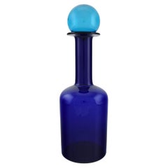 Otto Brauer for Holmegaard. Large Bottle in Blue Art Glass with Blue Ball
