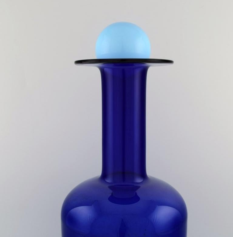 Scandinavian Modern Otto Brauer for Holmegaard. Large bottle in blue art glass with light blue ball. For Sale