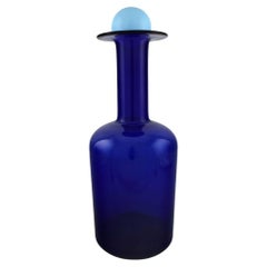 Otto Brauer for Holmegaard. Large bottle in blue art glass with light blue ball.