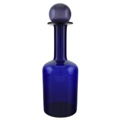 Otto Brauer for Holmegaard. Large bottle in blue art glass with purple ball