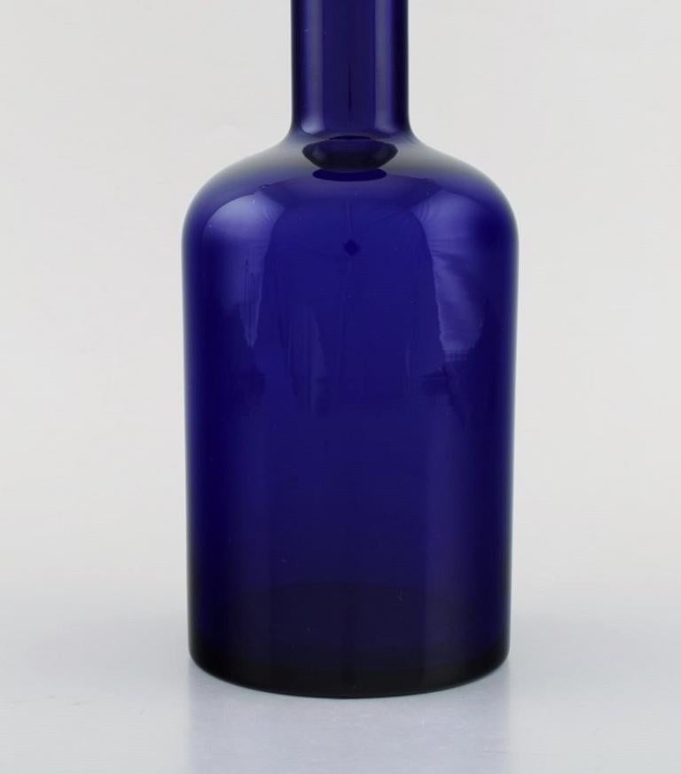 Scandinavian Modern Otto Brauer for Holmegaard. Large bottle in blue glass with blue ball For Sale