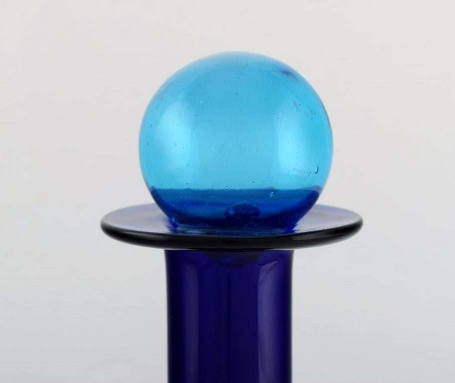 Danish Otto Brauer for Holmegaard. Large bottle in blue glass with blue ball For Sale