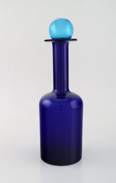 Otto Brauer for Holmegaard. Large bottle in blue glass with blue ball