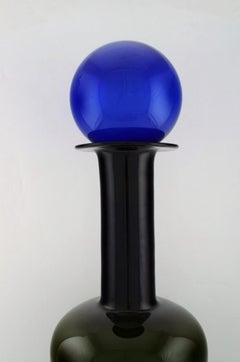 Otto Brauer for Holmegaard.  Large bottle in dark blue and green art glass