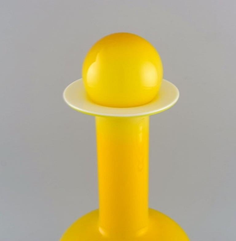 Scandinavian Modern Otto Brauer for Holmegaard. Large bottle in yellow art glass with yellow ball For Sale