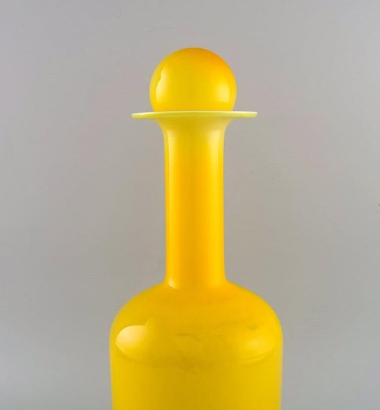 Danish Otto Brauer for Holmegaard. Large bottle in yellow art glass with yellow ball For Sale
