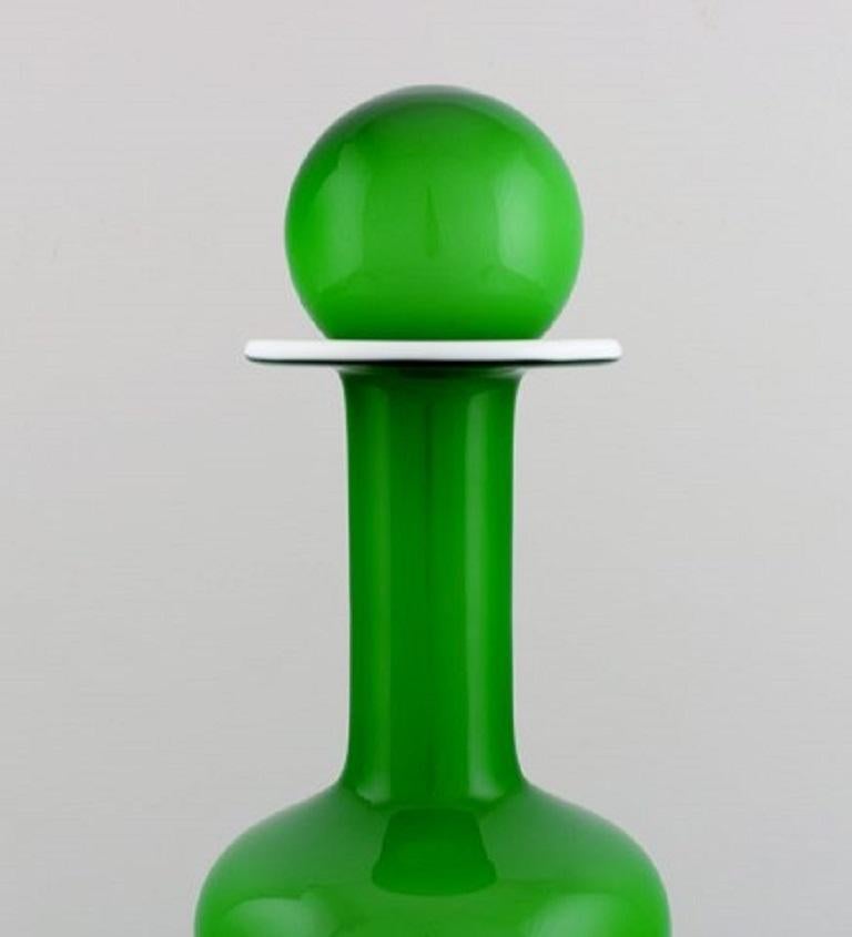 Otto Brauer for Holmegaard. Large rare vase / bottle in light green art glass with light green ball, 1960s.
Measures: 36 x 12 cm (incl. Ball).
In perfect condition.