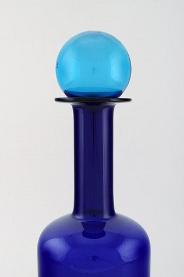 Otto Brauer for Holmegaard. Large vase / bottle in blue art glass with blue ball, 1960s.
Measures: 37.5 x 12 cm (incl. Ball).
In perfect condition.