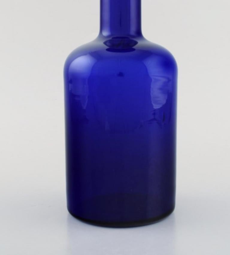 Scandinavian Modern Otto Brauer for Holmegaard. Large vase / bottle in blue art glass with blue ball For Sale