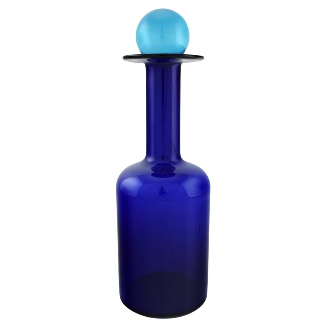 Otto Brauer for Holmegaard. Large vase / bottle in blue art glass with blue ball For Sale