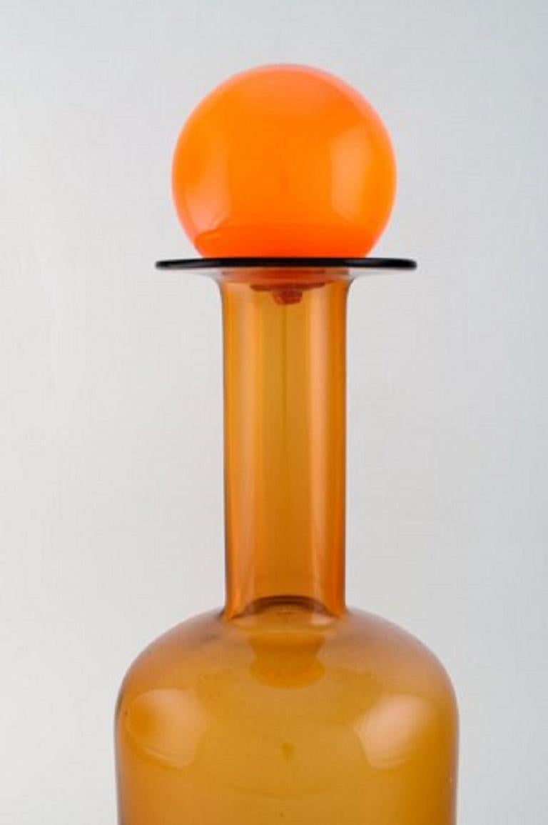 Otto Brauer for Holmegaard. Large vase / bottle in light brown art glass with orange ball, 1960s.
Measures: 44.5 x 15 cm (incl. Ball).
In perfect condition.

   