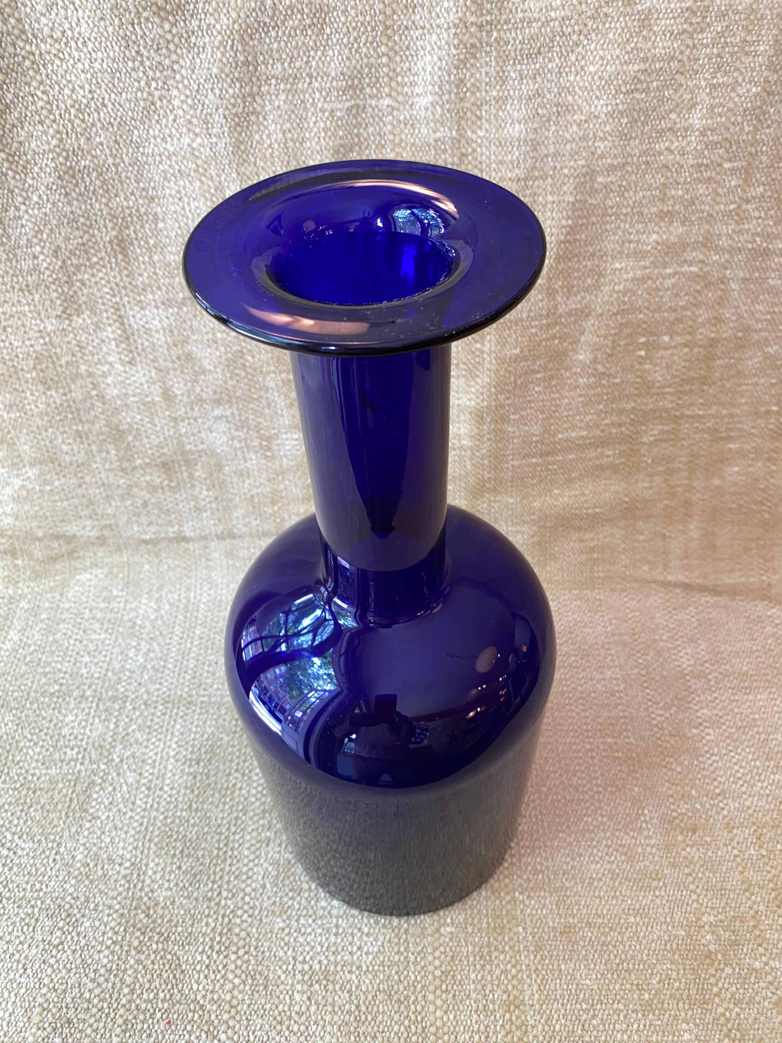 Otto Brauer for Holmegaard tall cobalt blue glass vase. Originally designed in 1959, were produced into the late 1970's. Vase is in very nice condition! Stands almost 15