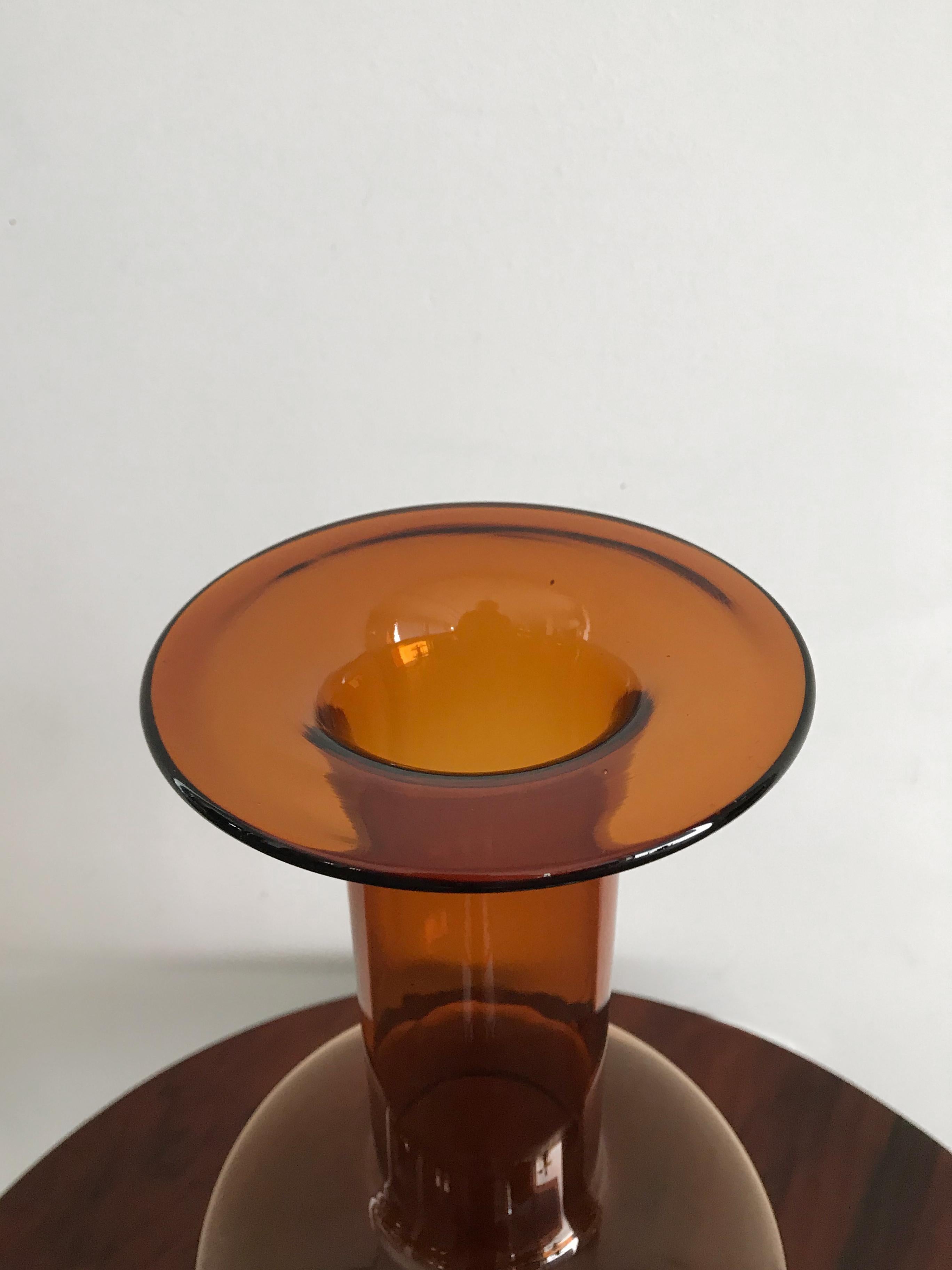 Iconic yellow glass Scandinavian bottle or vase designed by Otto Brauer for Holmegaard, made in Denmark 1960s, extra large sizes.

Please note that the vase is original of the period and this shows normal signs of age and use.
 