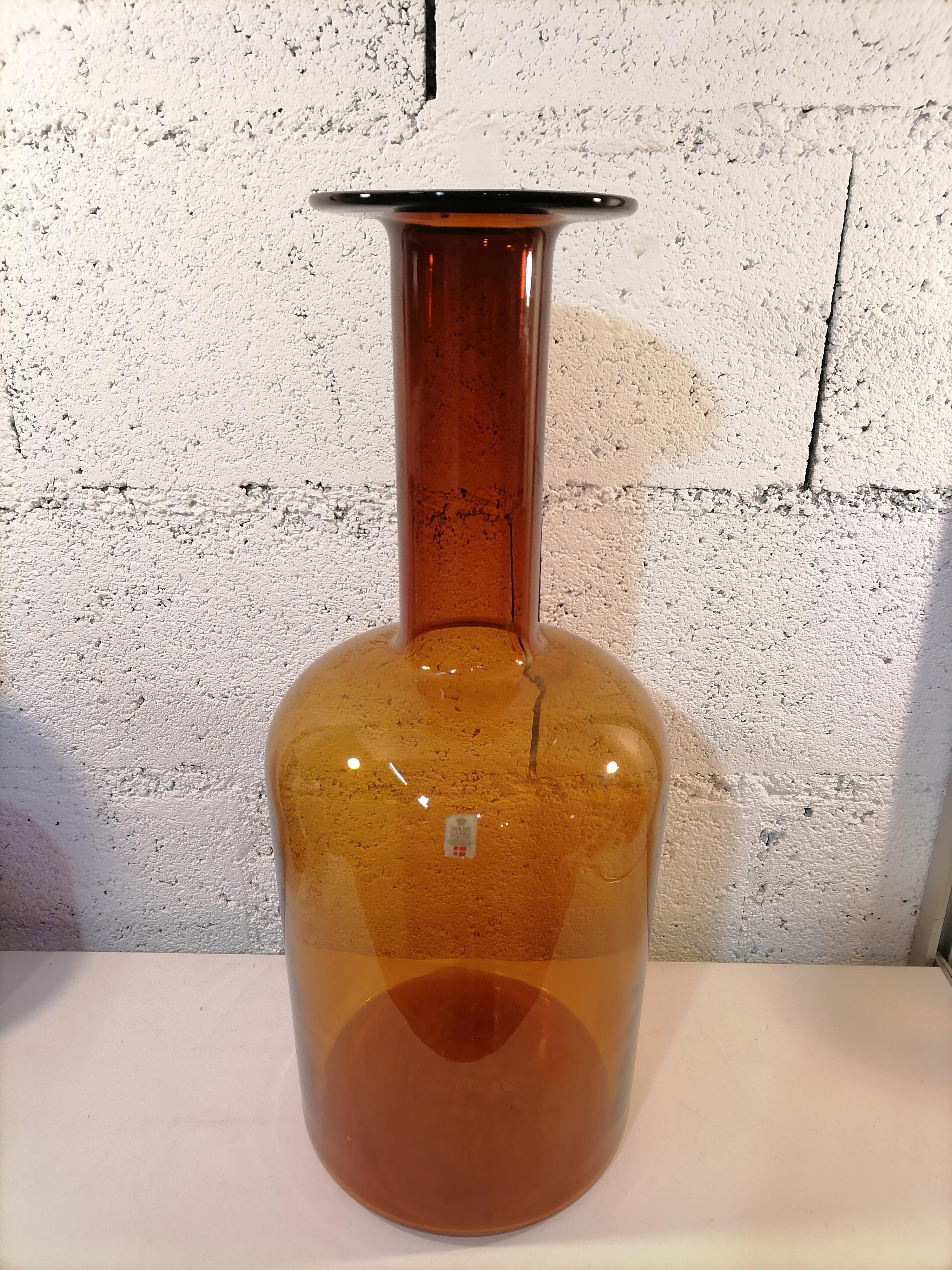 Otto Brauer Scandinavian vase bottle Holmegaard 1960, 50cm

Big vase or bottle in brown art glass
Made in Denmark in the 1960's with original label.
There is a set available with an other brown bottle and 2 blue

Measures: height 50 cm