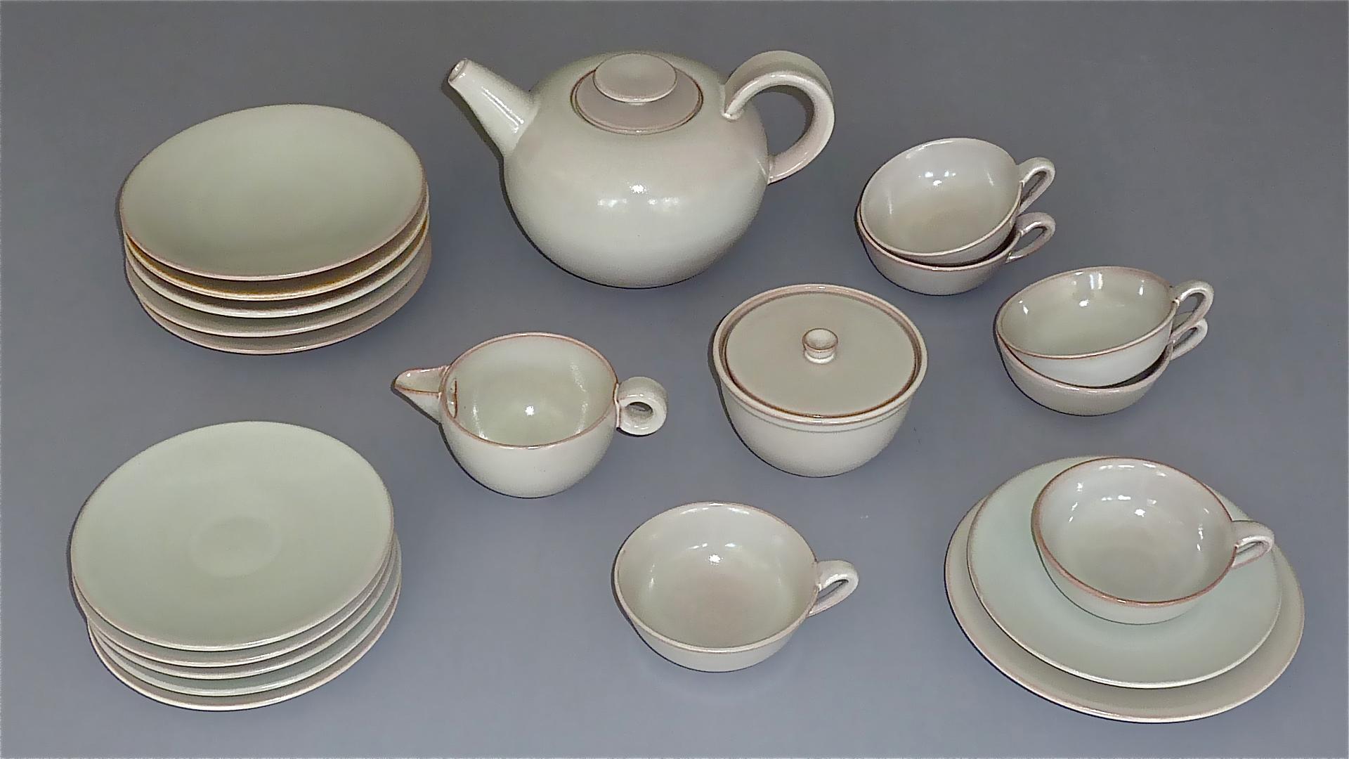 Rare Bauhaus tin-glazed crackled earthenware tea service designed by Otto Lindig and executed by Karlsruher Majolica, Germany 1923 / circa 1930. The complete set in creamy grey beige and faint rose to pink color for six persons includes, 1 tea pot