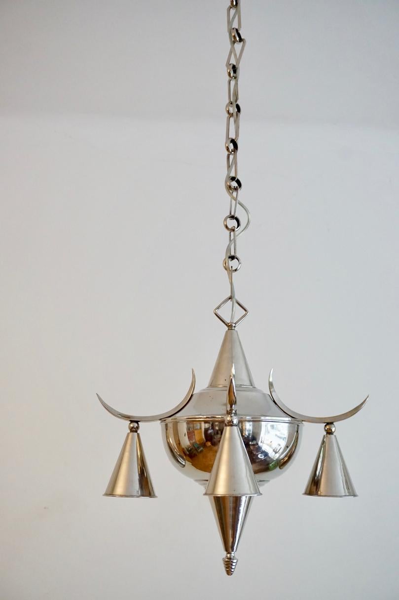 Otto Prutscher (in style of) chandelier 

This chromed chandelier was produced in Vienna during the 1920s. It is designed in the style of Otto Prutscher and perfectly demonstrates development of the style of the Wiener Werkstatte during the